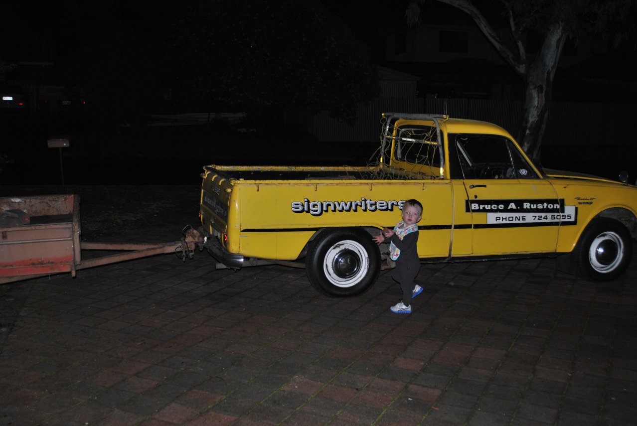 front yard - 07 July - paver removal - 06 - Joseph putting rocks in Wasp.JPG